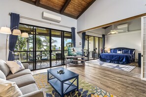 Living room looking towards the primary bedroom with sliding doors