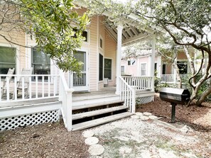SPACIOUS BACK PORCH WITH OUTDOOR GRILL AND SEATING