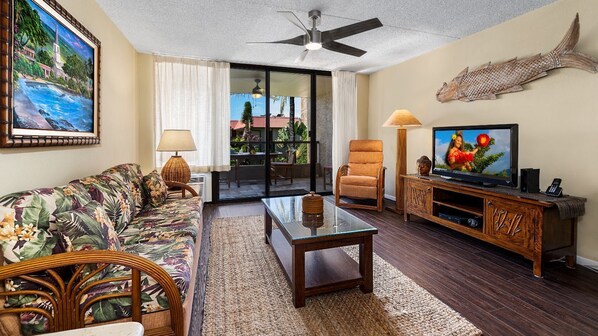 A sofa with a flat screen tv
