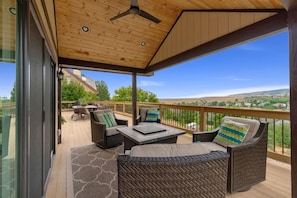 Beautiful covered deck with a fire pit and incredible views of the Foothills!