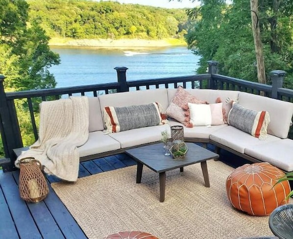 Welcome to Waterfront Getaway! Catching up with friends and family on the deck, surrounded by mature trees, while overlooking Iowa River and Sugar Bottom State Park:)
