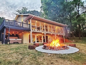Escape to tranquility: A serene vacation rental home with a blazing fire pit, inviting deck, and the soothing embrace of nature. Enjoy S'mores and share stories while enjoying this huge firepit:)