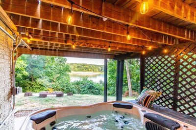 Completely unwind and let your worries disappear in this covered hot tub that can comfortably fit 6 adults. You will love this even more when it snows out!!
