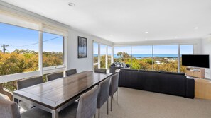 Next to the living room is an elegant dining area that can accommodate a large group