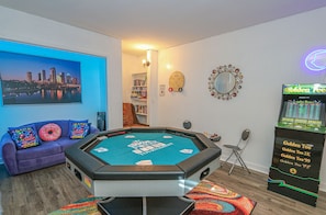 Air hockey table shown as the poker table. Chairs are in the lighted nook