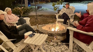 Cozy up around the firepit after dinner! S’mores anyone?