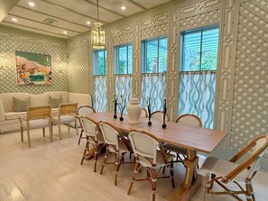 Dining room with settee. Added in 2025. Table has leaves and seating for 10