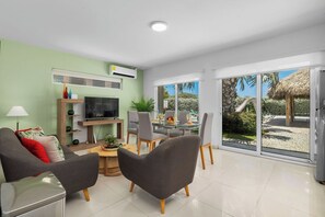 Whether you're planning a movie night, a cozy nap, or a casual hangout, this chic and spacious living area provides the perfect setting. The large, comfortable couch and open floor plan invite you to stretch out and enjoy your time in paradise