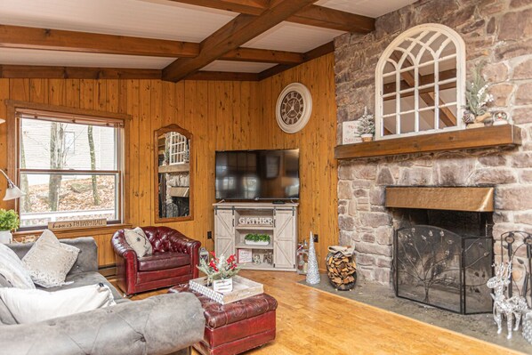 Expansive Great Room with dramatic stone wood-burning fireplace!