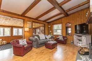 Sundrenched Great Room with Stone Wood-burning Fireplace & Vaulted Ceilings! 