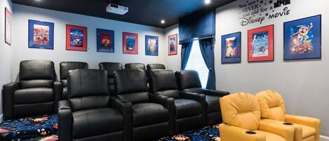 Disney theme private home theater with 9 leather recliners & 2 toddler recliners