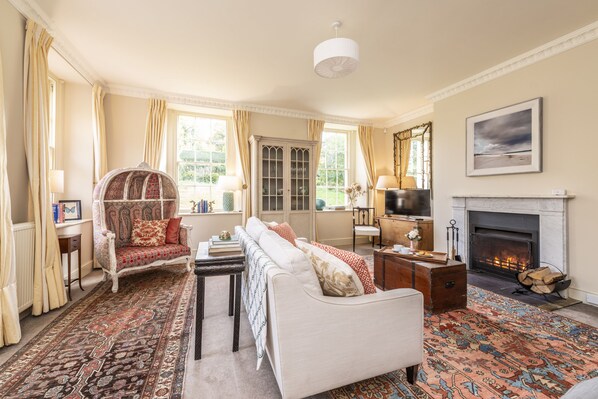 Ground floor:  Spacious sitting room with open fire