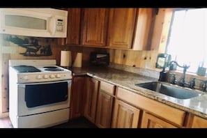 Modern kitchen with all needed accessories. 