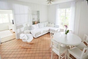 The living room and the kitchen are in the center in the cottage. The couch pulls out into a comfy 3rd bed.