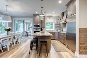 Main Level Kitchen, Dining Table and 4 Seasons Room