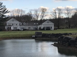 House viewed from behind our pond in fall.