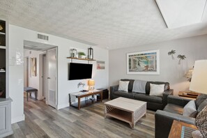 Bright and Airy Living Space with Flat Screen Smart TV