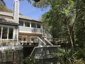 Large back deck for gathering and cooking out on gas grill. 