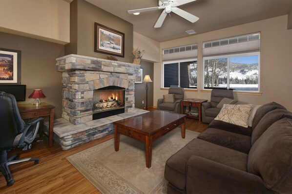 Main level living area with smart TV and gas fireplace.