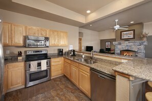 Full kitchen with stainless steel appliances on the main level.