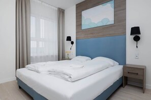 Comfortable double bed in the bedroom. 
