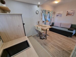 Dining area. kitchen, dining area, sleeping couch for 2 persons