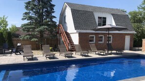 Courtyard with pool and fire pit behind