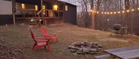 Very secluded, wooded backyard with creek rock lined firepit. Firewood stocked!