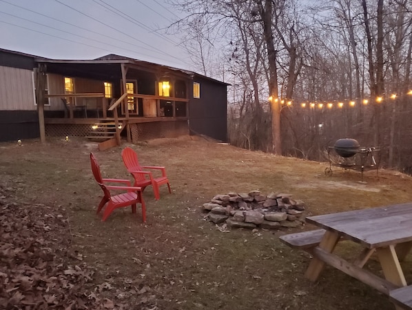 Very secluded, wooded backyard with creek rock lined firepit. Firewood stocked!