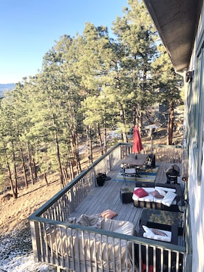 View of main level deck from master bedroom private balcony.