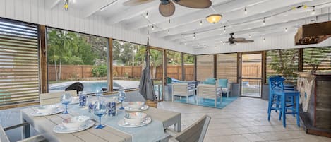 Screened in lanai/porch with dining area