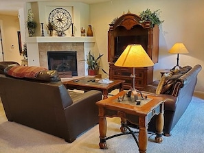 Livingroom area with gas fireplace and TV with Hulu + live TV