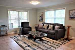 Living room with recliner and queen pull out bed