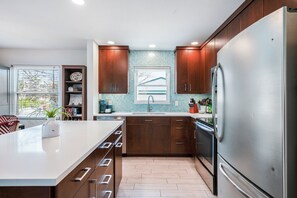Updated kitchen with quartz counters and stainless appliances