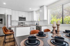 Fully stocked kitchen with dining space for 6