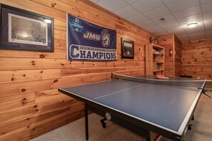 Full size ping pong table to enjoy in the downstairs' game room.