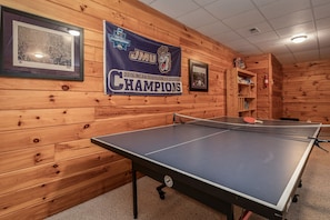 Full size ping pong table to enjoy in the downstairs' game room.