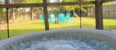 Enjoy the hot tub in the screened in porch.