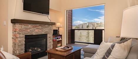 Family Room with Double Doors Opening to the Balcony.  