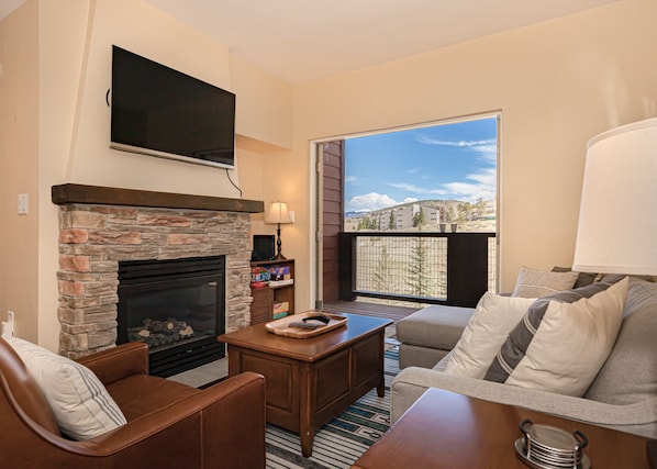 Family Room with Double Doors Opening to the Balcony.