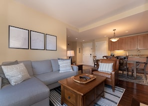 Gas fireplace, flat-screen TV, plush furnishings, open-concept living area....