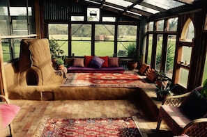 Cosy conservatory for lounging. Seats 10