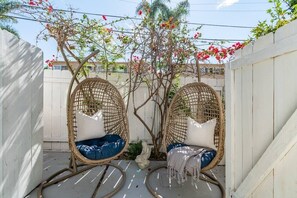 Two chairs pictured, although now one of the chairs has been traded out for a BBQ for you to enjoy.