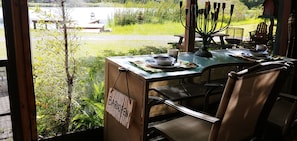 breakfast on screened in porch with pond view