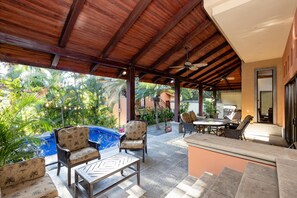 You'll find a spacious covered veranda with three seating areas to relax and unwind.