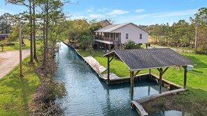 Welcome to White Lane - White Lane property is located in Gulf Shores on beautiful Plash Island, and features canal frontage, perfect for fishing and boating.