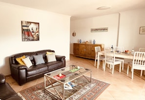 Spacious living room with dining table.