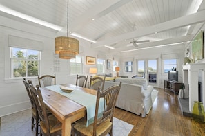DINING AREA NEXT TO LIVING WITH TABLE SEATING SIX