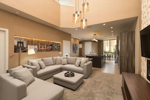 Nicely appointed living room a seating area and terrace