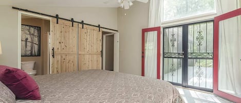 Large spacious bedroom that leads to the hot tub